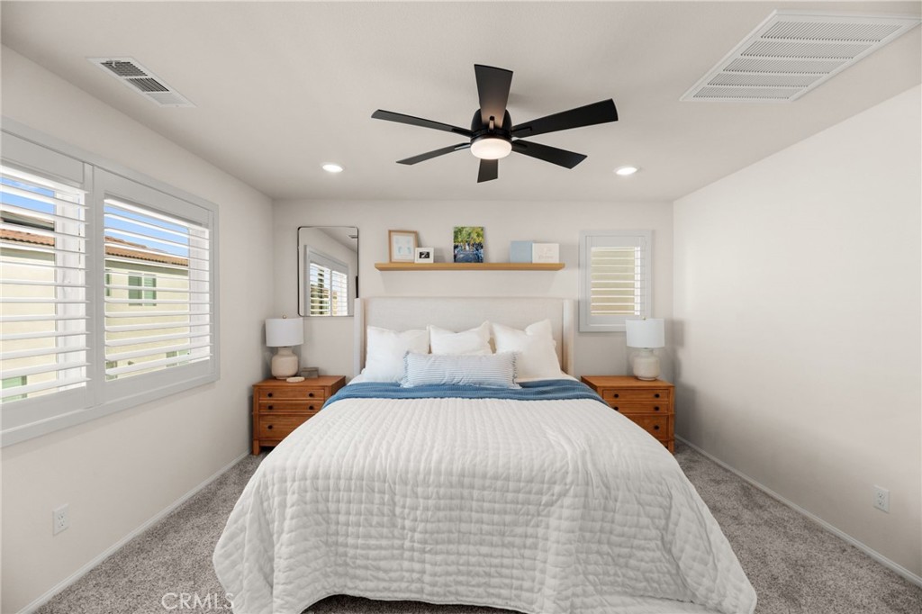 36362 Arcs Street Winchester, CA 92596 - Photo 42 of 54 a bedroom with a bed and a large window