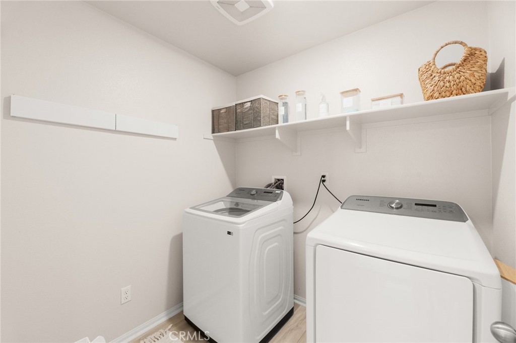 36362 Arcs Street Winchester, CA 92596 - Photo 46 of 54 a utility room with dryer and washer