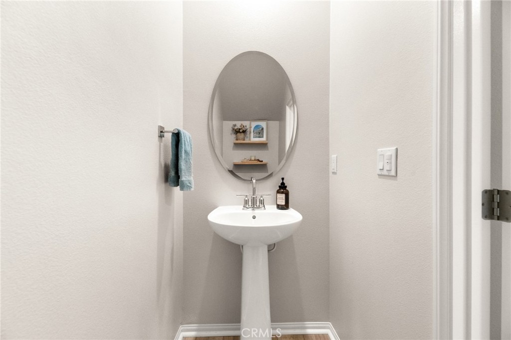 36362 Arcs Street Winchester, CA 92596 - Photo 47 of 54 a bathroom with a sink and a mirror