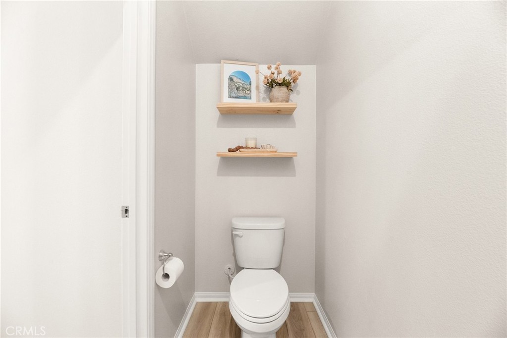 36362 Arcs Street Winchester, CA 92596 - Photo 48 of 54 a white toilet sitting next to a white sink