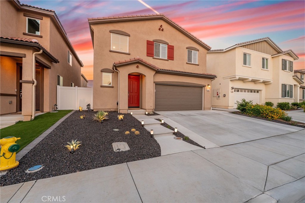 36362 Arcs Street Winchester, CA 92596 - Photo 8 of 54 a front view of a house with a yard