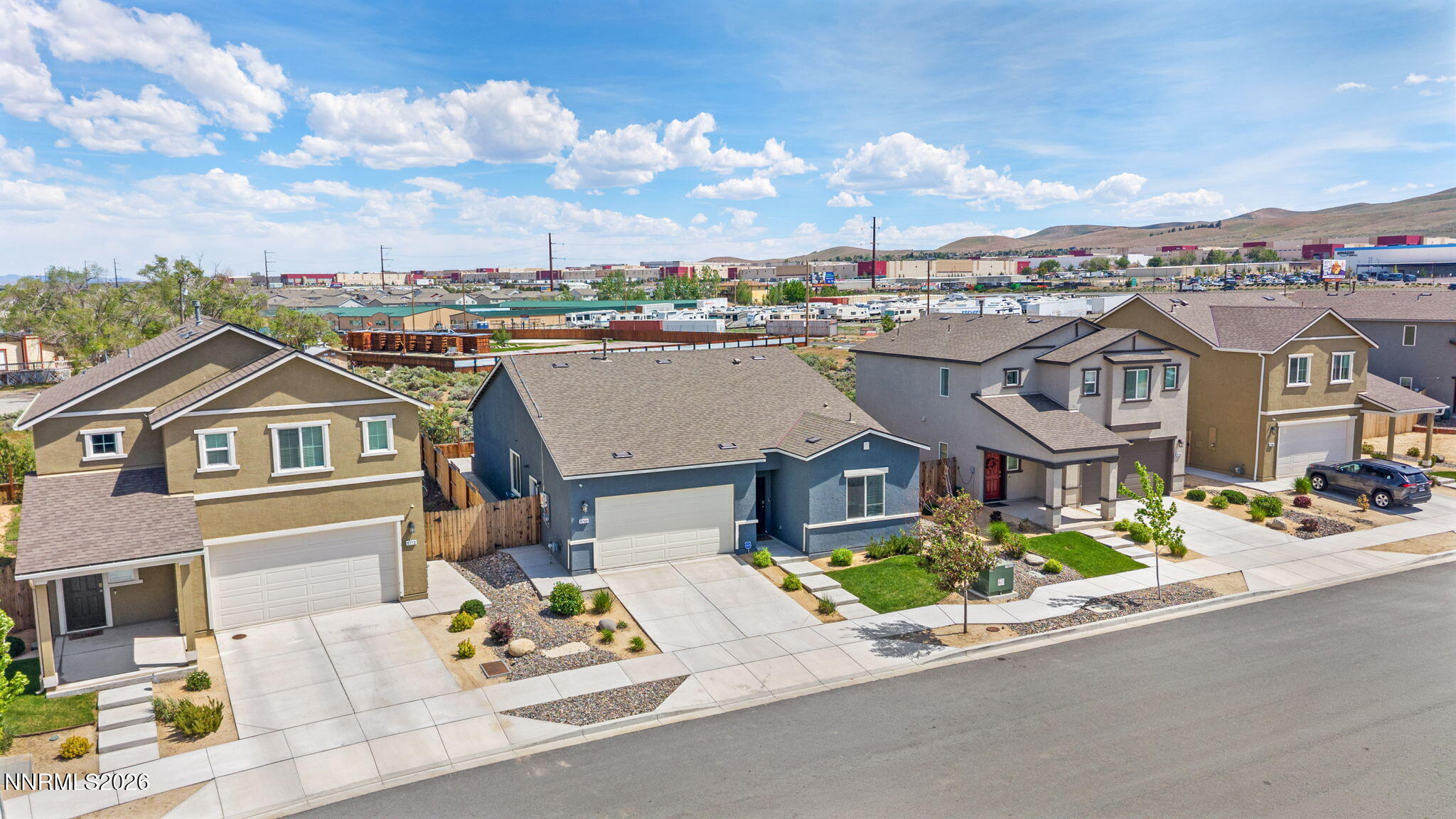 9708 Sea Glass Drive Reno, NV 89506 - Photo 42 of 51 a front view of a house with a garden and houses