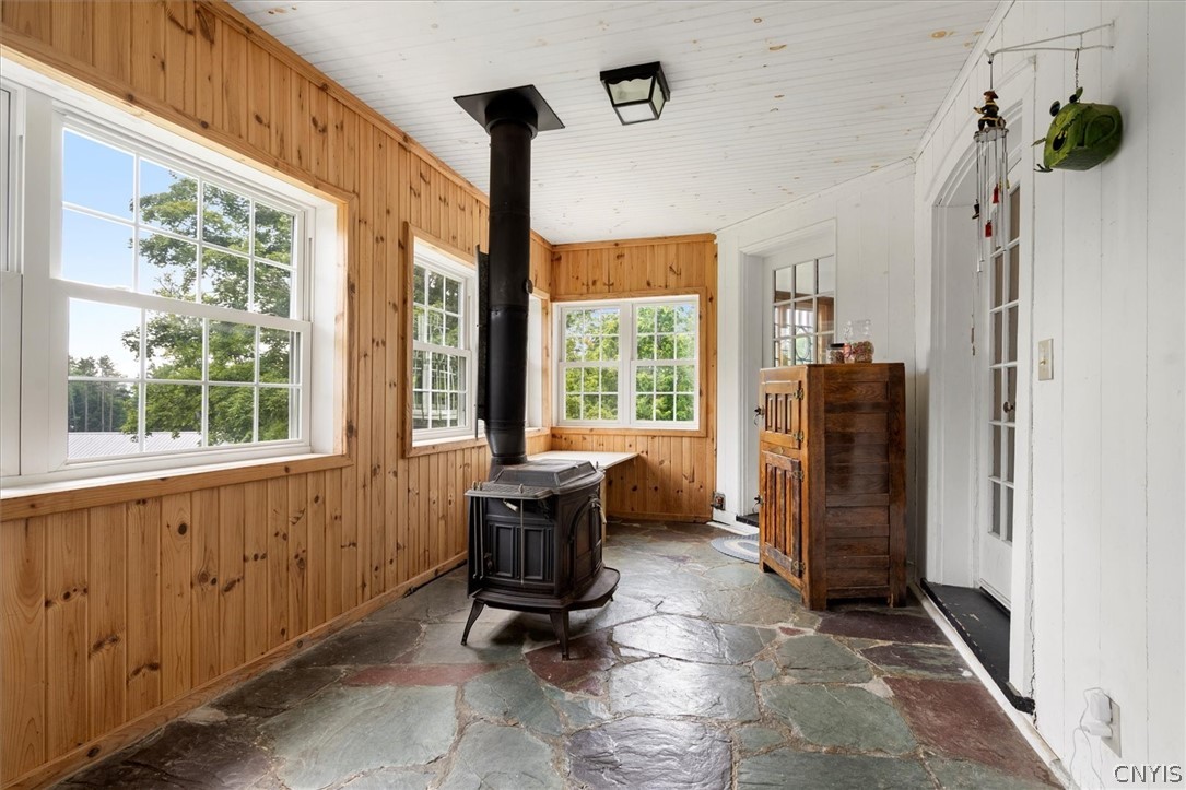 52 East State Street Sherburne, NY 13460 - Photo 11 of 50 A slate floored back entrance with woodstove leads