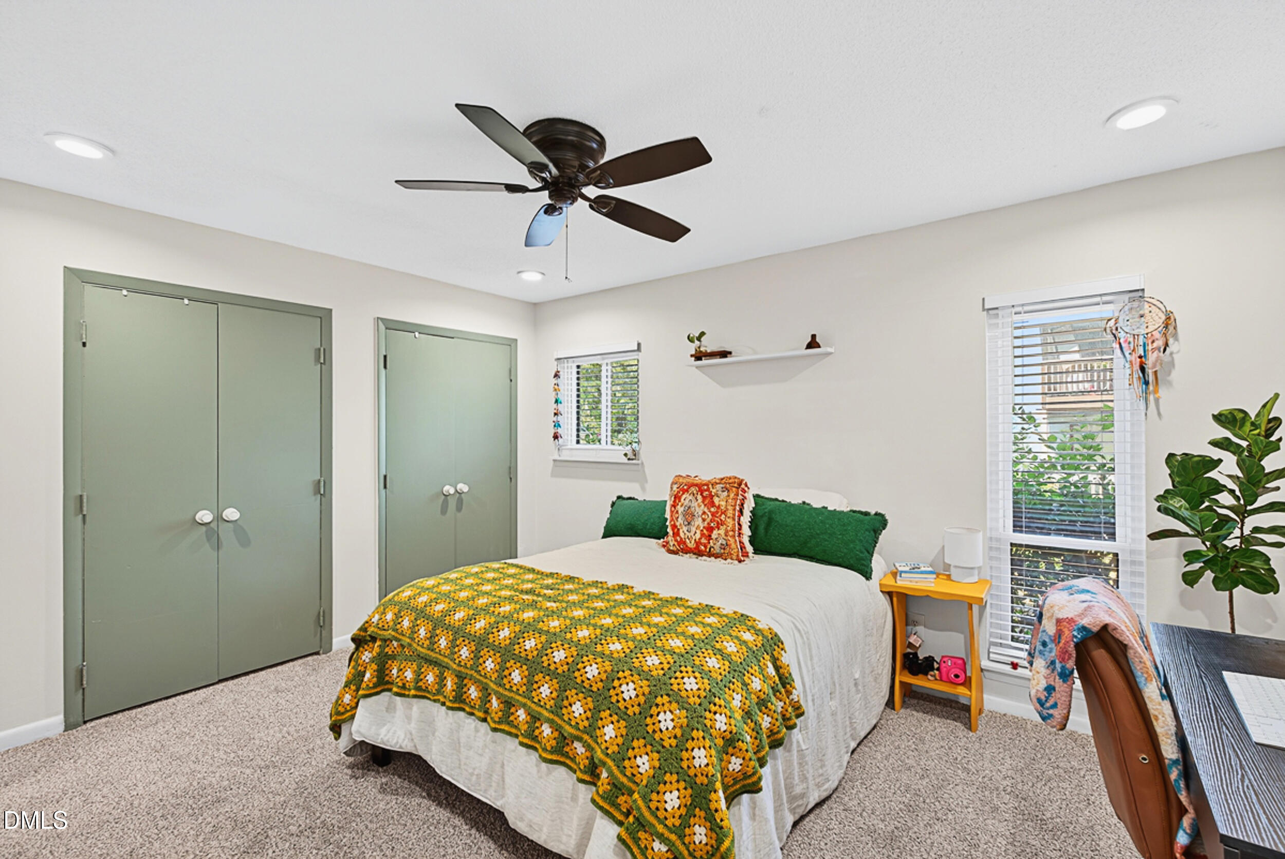 5080 Flint Ridge Place Raleigh, NC 27609 - Photo 12 of 24 a bedroom with a bed and a window