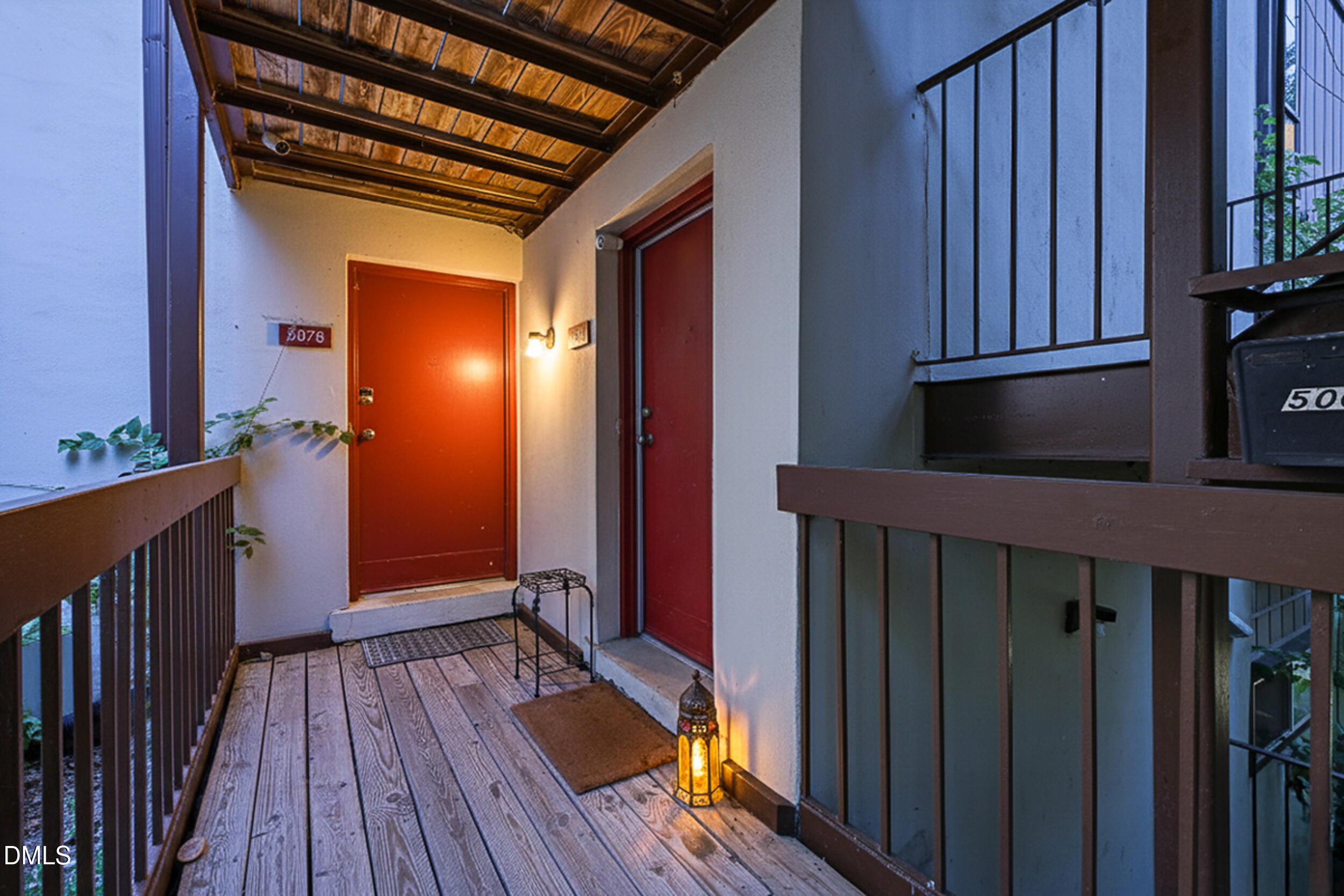 5080 Flint Ridge Place Raleigh, NC 27609 - Photo 18 of 24 a view of an entryway door with wooden floor