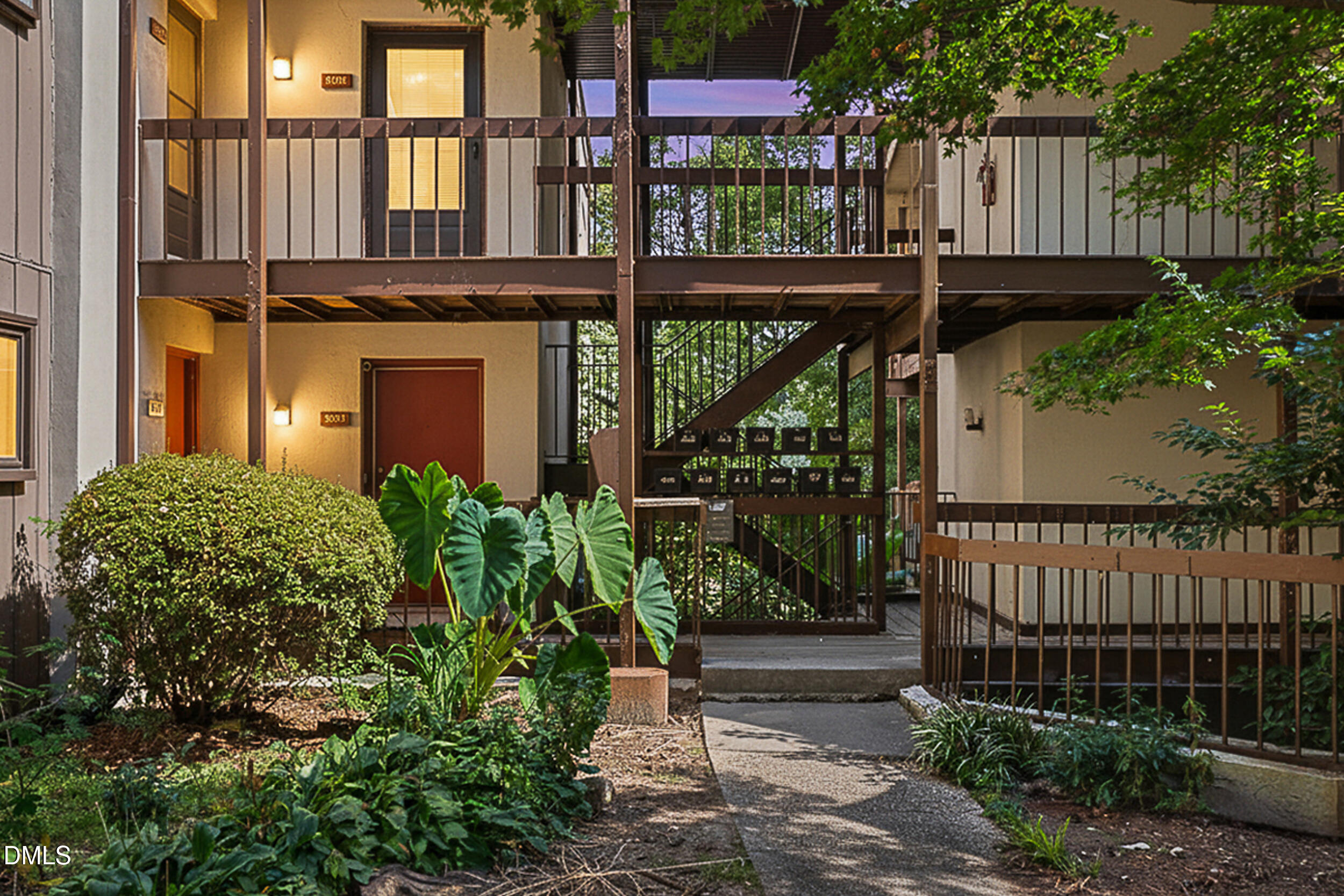 5080 Flint Ridge Place Raleigh, NC 27609 - Photo 20 of 24 front view of a house with a small yard