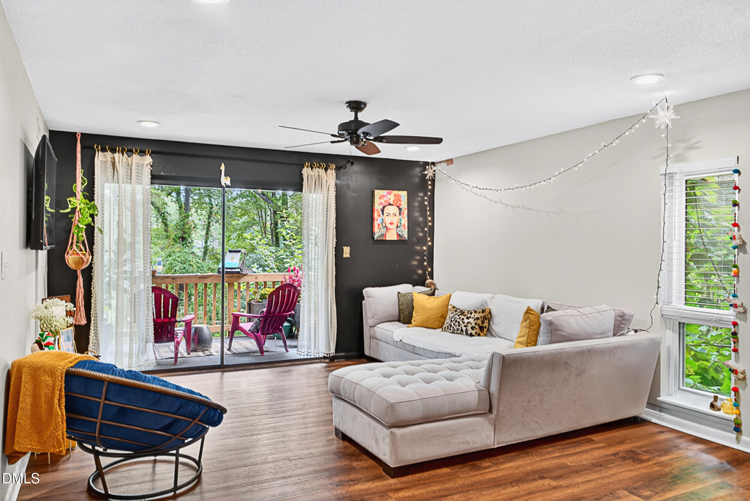 5080 Flint Ridge Place Raleigh, NC 27609 - Photo 4 of 24 a living room with furniture and a large window