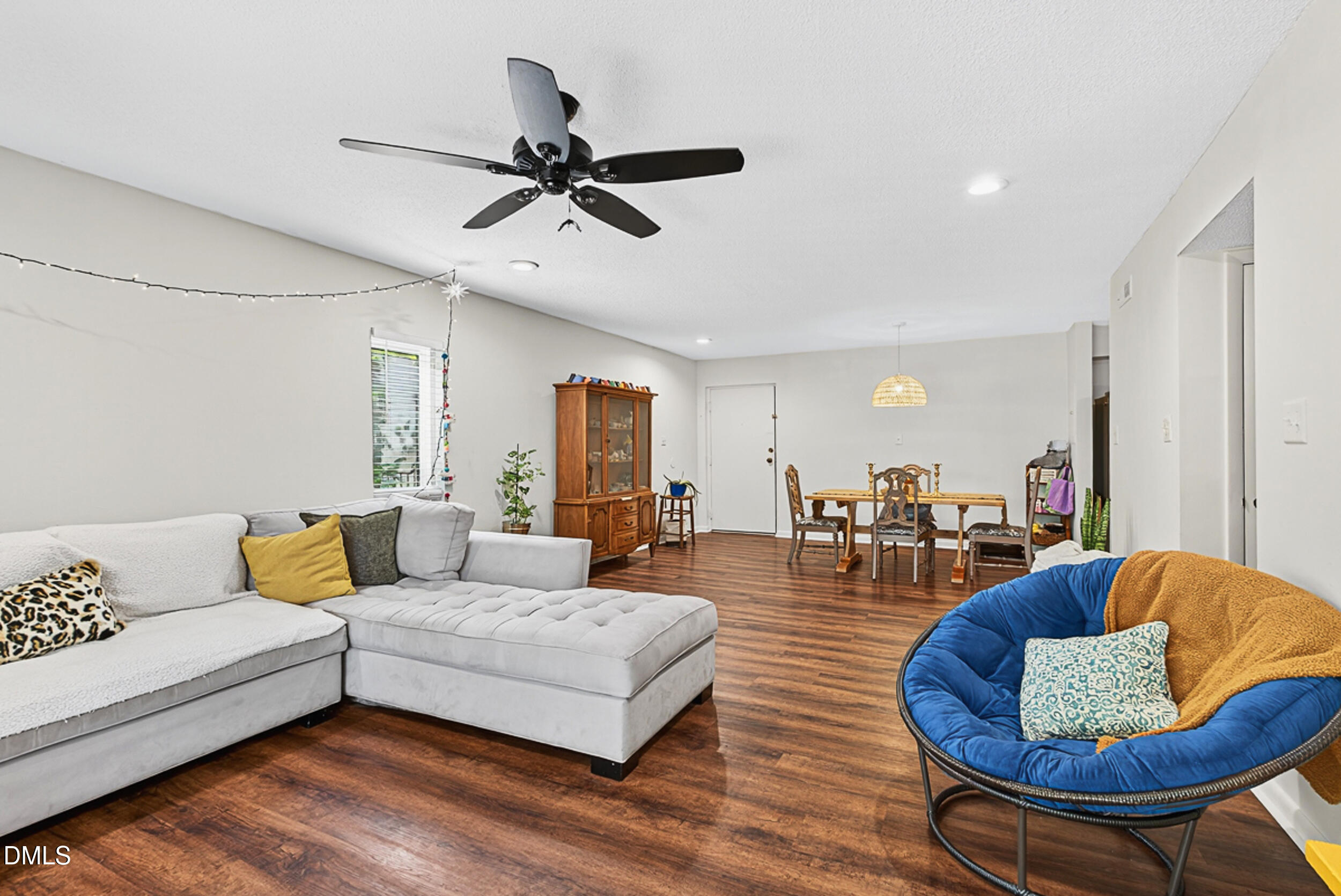 5080 Flint Ridge Place Raleigh, NC 27609 - Photo 5 of 24 a living room with furniture and a wooden floor