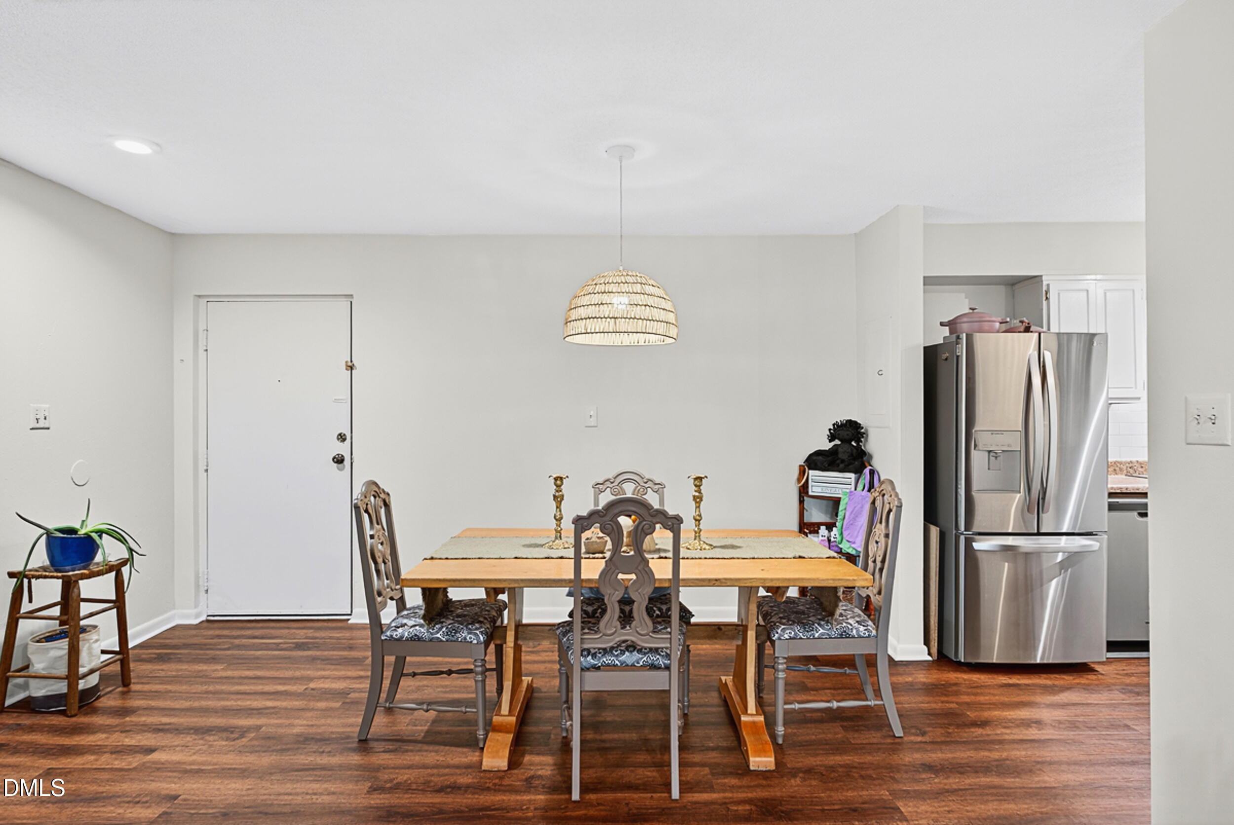 5080 Flint Ridge Place Raleigh, NC 27609 - Photo 6 of 24 a view of a dining room with furniture and wooden floor