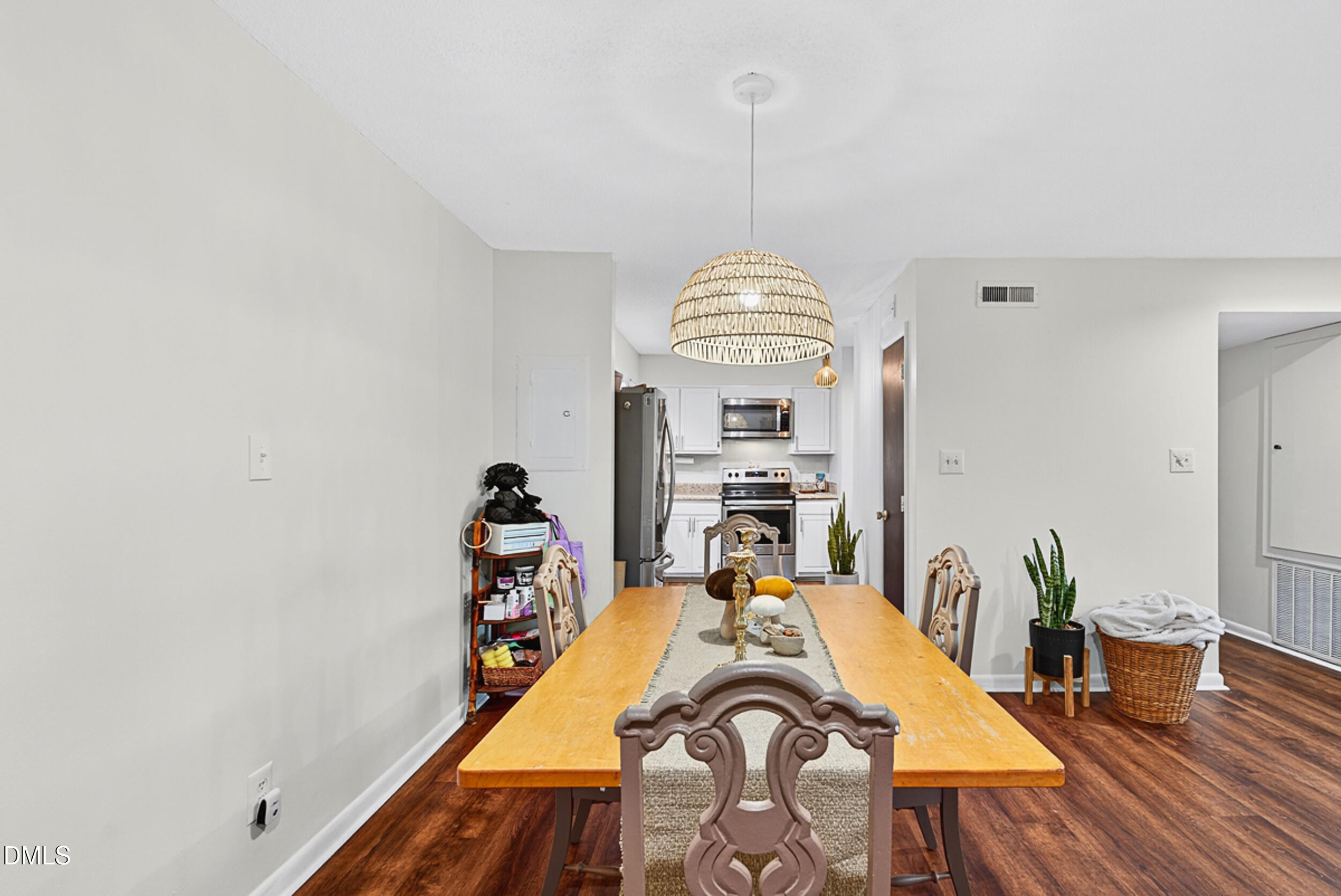 5080 Flint Ridge Place Raleigh, NC 27609 - Photo 7 of 24 a view of a dining room with furniture window and wooden floor