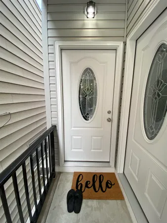 a bathroom with a toilet and a mirror