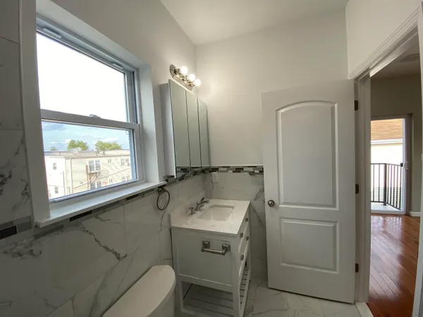 a bathroom with a sink a toilet and a bathtub