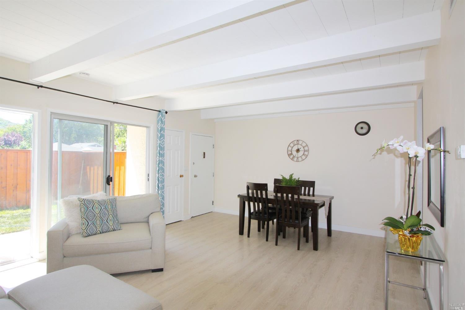1548 Center Road, Unit 22 Novato, CA 94947 - Photo 1 of 1 a living room with furniture and a large window