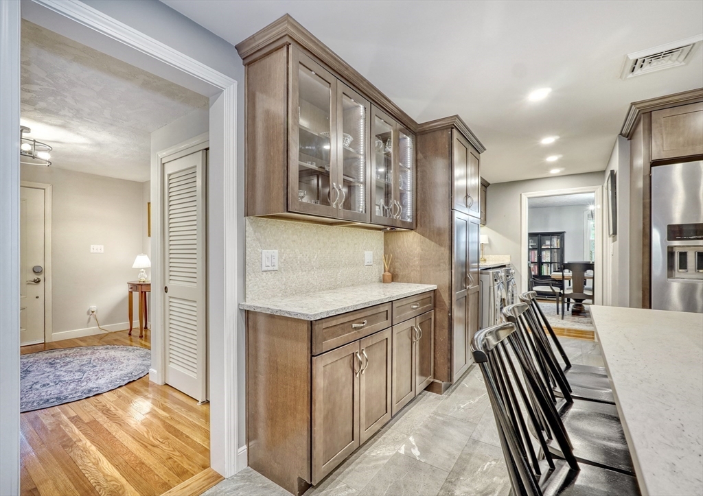 162 Border Road Concord, MA 01742 - Photo 11 of 39 a kitchen with a refrigerator and a sink