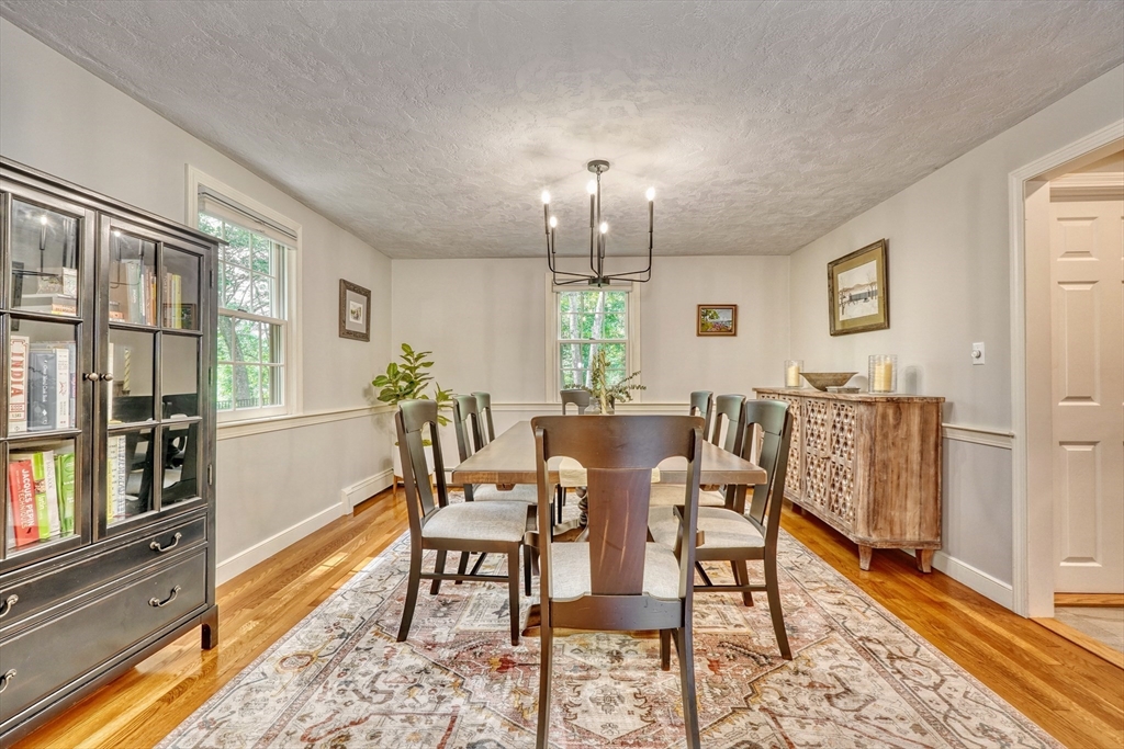 162 Border Road Concord, MA 01742 - Photo 16 of 39 a view of a dining room with furniture window and wooden floor