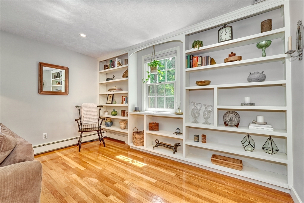 162 Border Road Concord, MA 01742 - Photo 18 of 39 a living room with furniture cabinets and a rug