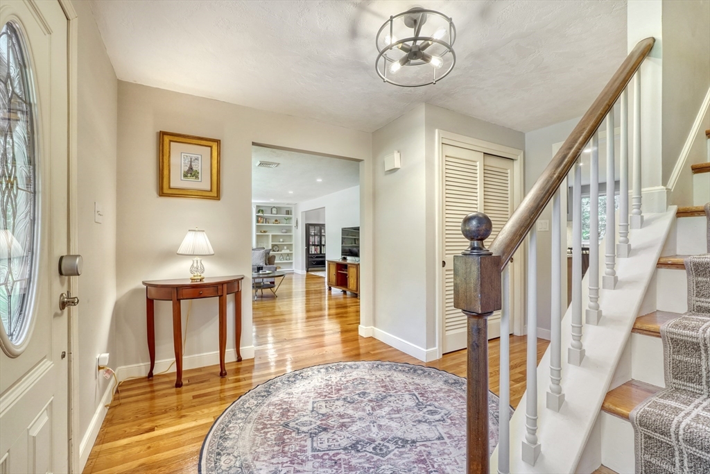 162 Border Road Concord, MA 01742 - Photo 21 of 39 a view of an entryway with wooden floor and a livingroom view