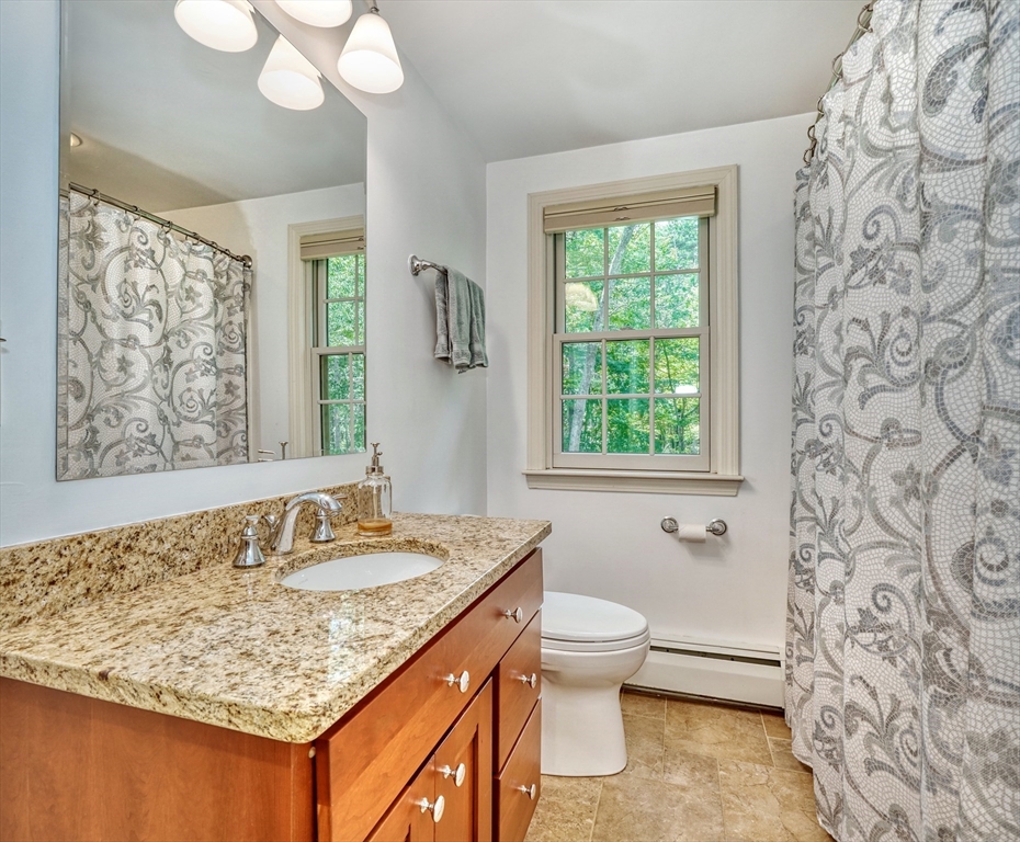 162 Border Road Concord, MA 01742 - Photo 22 of 39 a bathroom with a granite countertop sink and a mirror