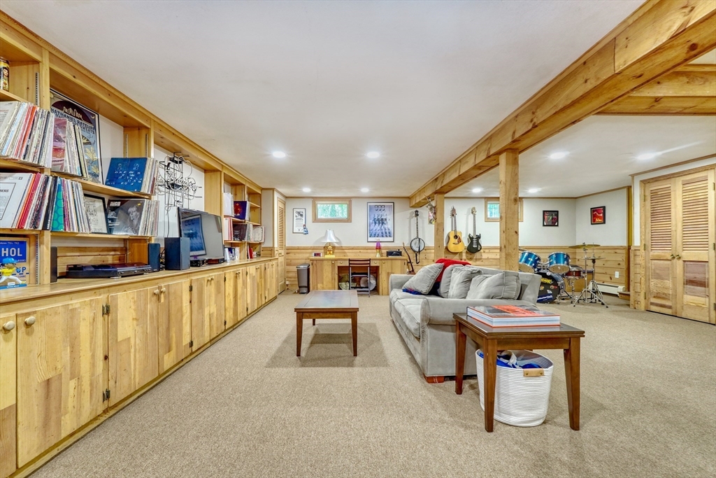162 Border Road Concord, MA 01742 - Photo 31 of 39 a living room with furniture and a book shelf
