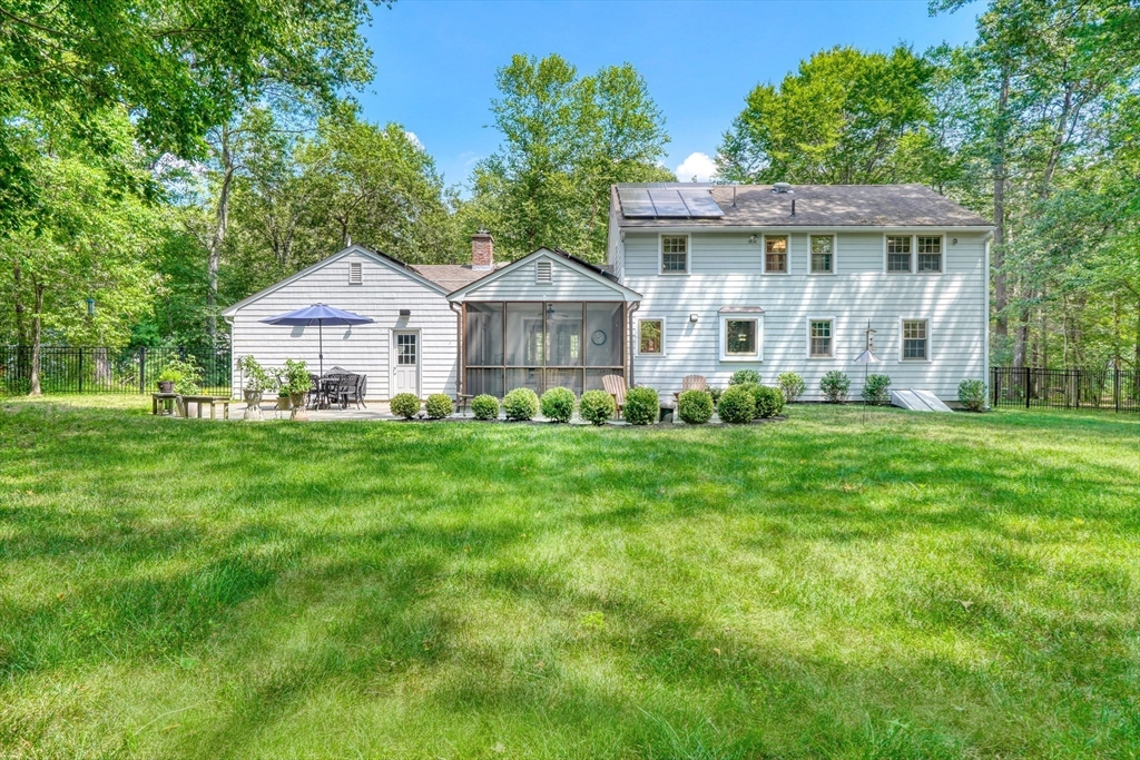 162 Border Road Concord, MA 01742 - Photo 38 of 39 a front view of a house with a yard and green space