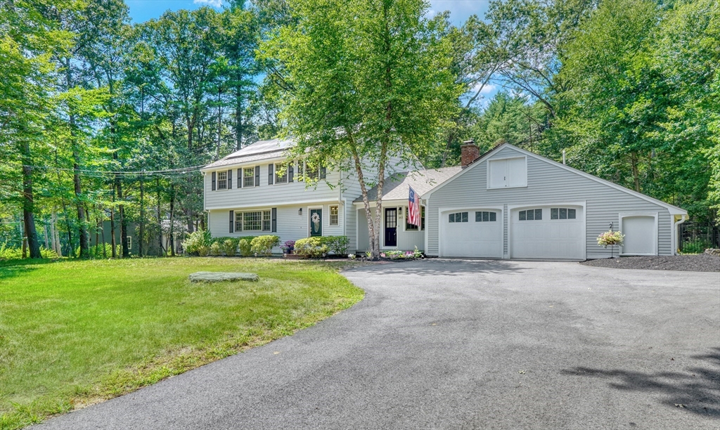 162 Border Road Concord, MA 01742 - Photo 39 of 39 a front view of a house with a garden
