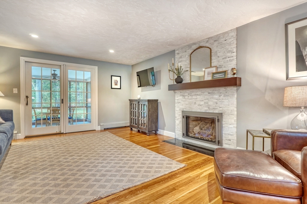 162 Border Road Concord, MA 01742 - Photo 4 of 39 a living room with furniture and a fireplace