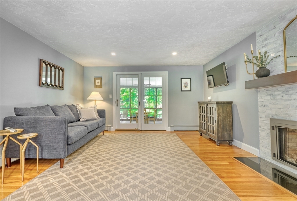 162 Border Road Concord, MA 01742 - Photo 6 of 39 a living room with furniture and a fireplace