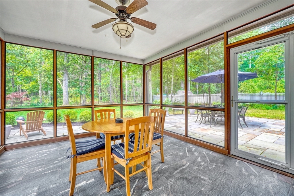 162 Border Road Concord, MA 01742 - Photo 8 of 39 a view of a dining room with furniture window and wooden floor