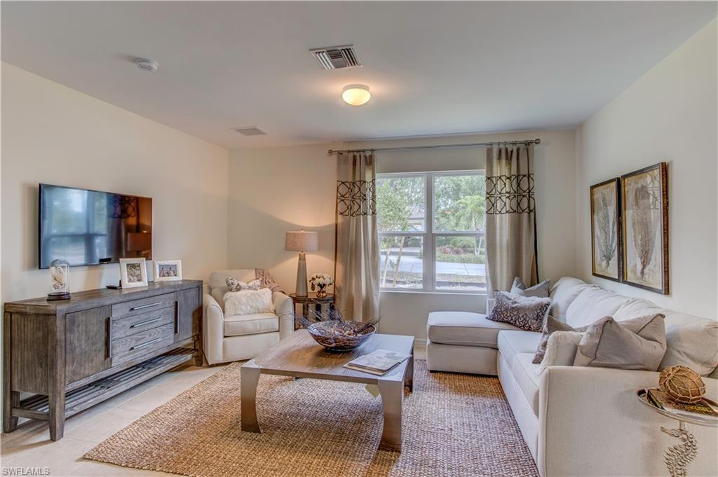 679 Hadley Place East Naples, FL 34104 - Photo 6 of 9 a living room with furniture and a flat screen tv