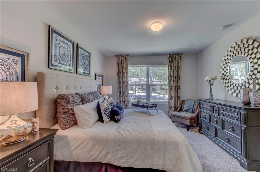 679 Hadley Place East Naples, FL 34104 - Photo 9 of 9 a bedroom with a bed and furniture