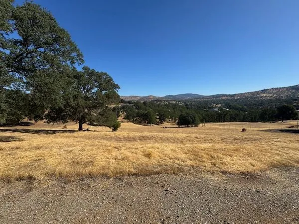 a view of a town with mountains in the background