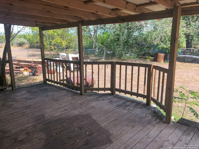 a view of outdoor space with wooden floor and outdoor seating