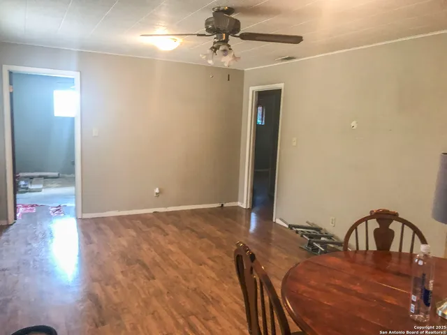 a view of a workspace with furniture and an entryway