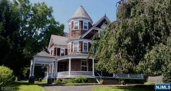 front view of a house with a garden