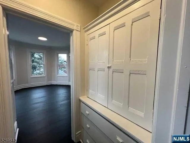 a view of an entryway with wooden floor