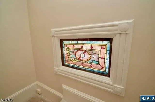 a view of a kitchen with a sink and a refrigerator