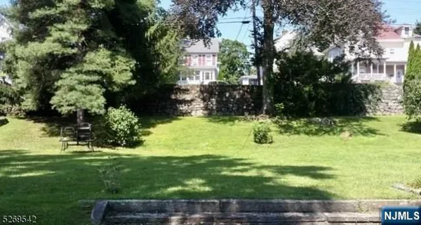 a view of backyard with green space