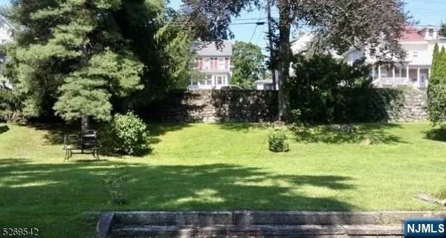 a view of backyard with green space