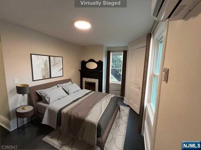 314 Cornelia Street Boonton, NJ 07005 - Photo 22 of 29 a bedroom with a bed and a large mirror