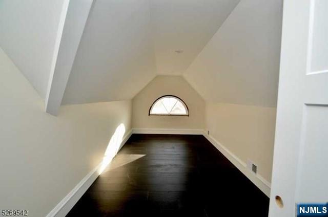 314 Cornelia Street Boonton, NJ 07005 - Photo 7 of 29 an empty room with wooden floor and windows