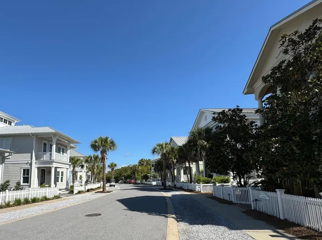 a view of a city street lined with buildings and trees