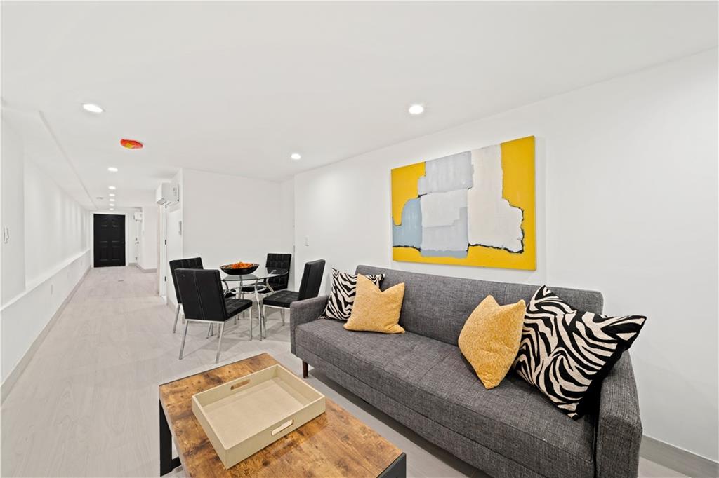 253 A Schaefer Street Brooklyn, NY 11207 - Photo 14 of 15 a living room with furniture and a couch