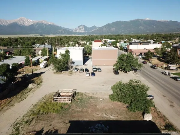 a view of a town with mountains in the background