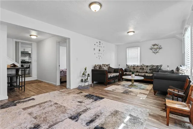 a view of a entryway door with wooden floor