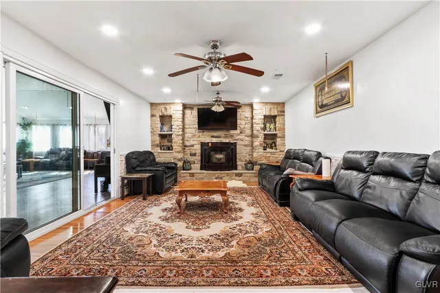 a kitchen with stainless steel appliances granite countertop a sink a stove and a refrigerator