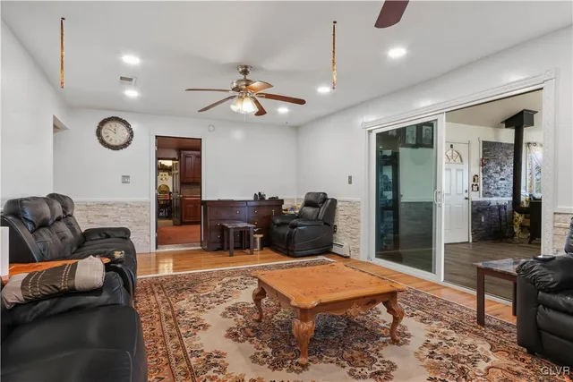 a view of a dining room with furniture and window