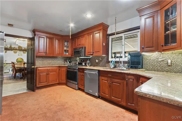 an empty room with furniture and a fireplace