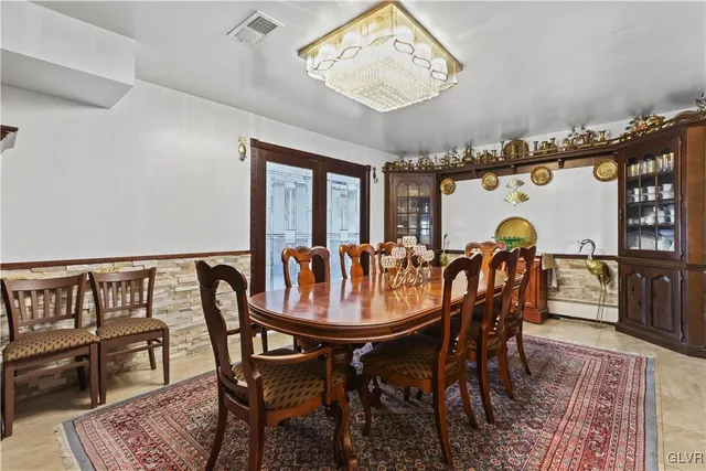 a bedroom with a bed chair and a window