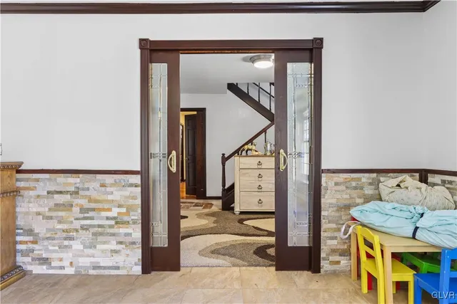 a living room with furniture and a rug