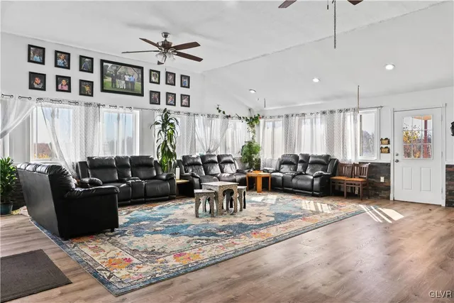 a kitchen with stainless steel appliances granite countertop a sink and a microwave